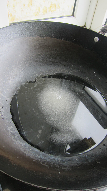 Add rock sugar and water to the pot.