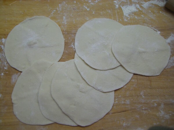 Press the small dough into a round cake. T