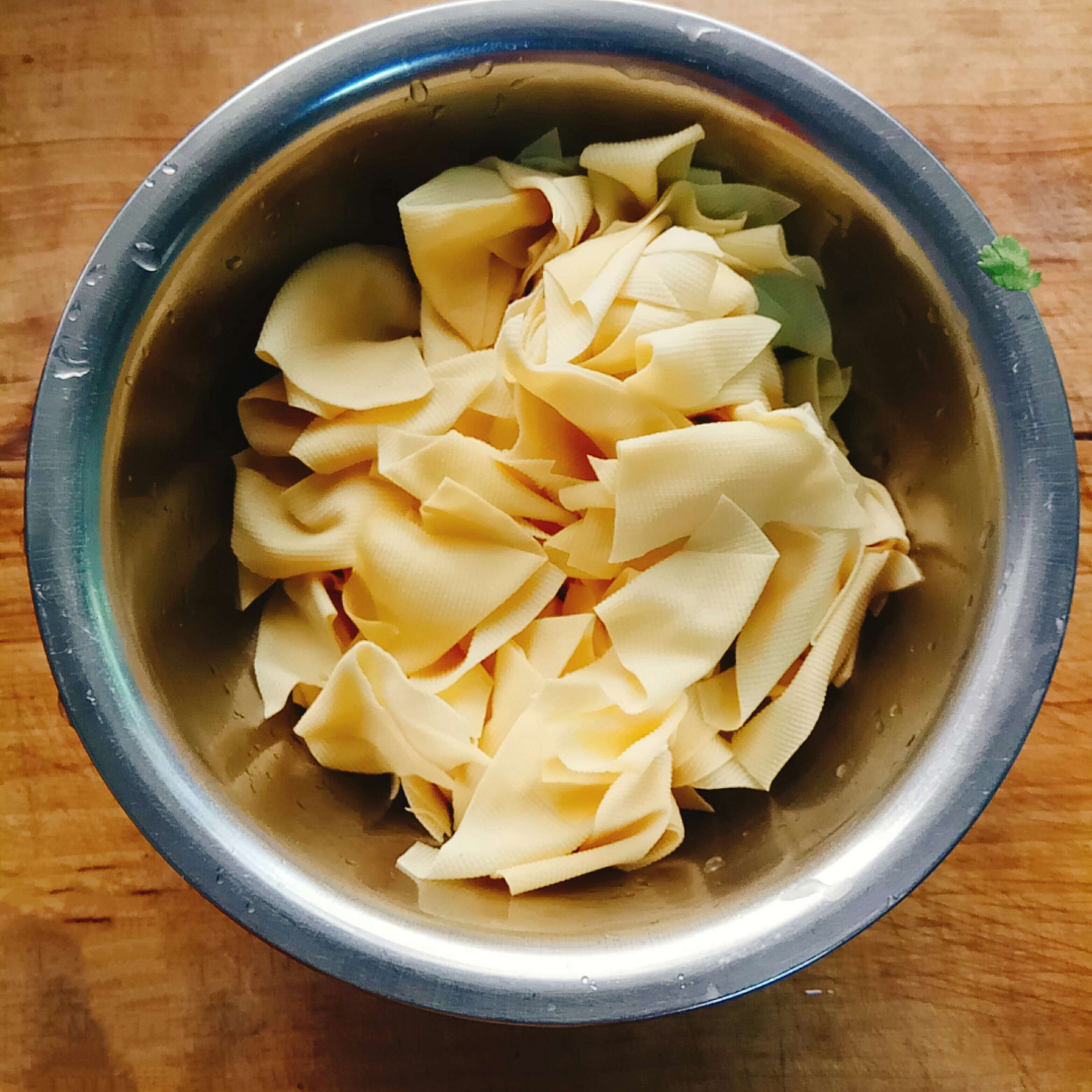 Blanch the dried tofu and take it out