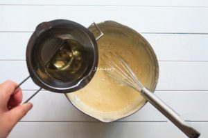 Pour the corn oil into the batter
