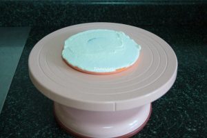 The first slice of cake is topped with a little whipped cream
