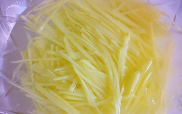 Peel the potato and shred