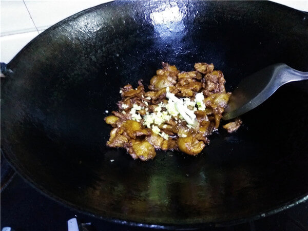 Add scallion and minced ginger and fry the aroma;