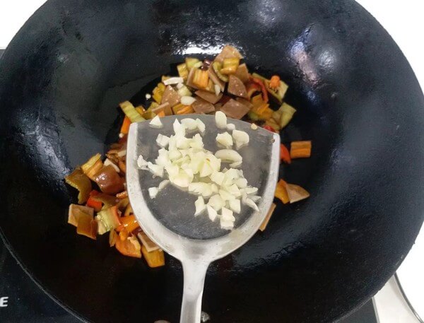 Add red peppers and dried tofu to stir fry until they are soft