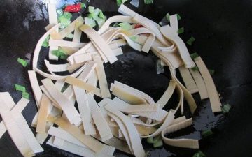 Add spring onion, and gingers to stir fry
