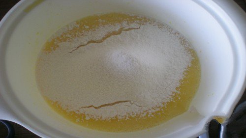 Sift the cake mix into the yolk mixture