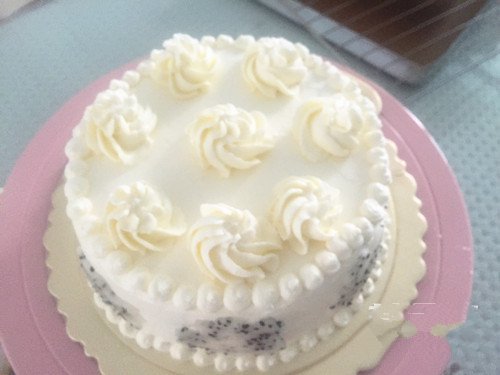 Top the cake with a few flower shapes