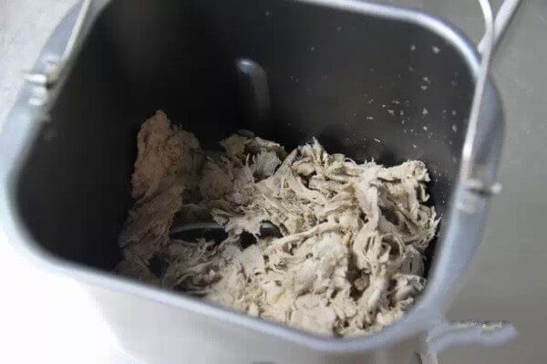 Pour the meat into the bread bucket