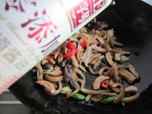 Add light soy sauce to stir fry for about 3 minutes
