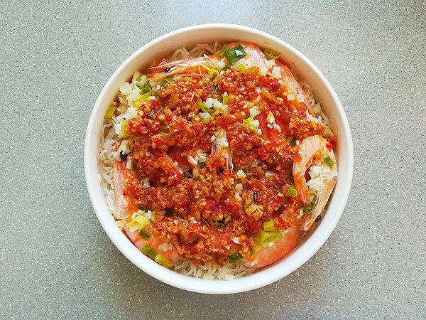 pour the seasonings evenly on top of the dish