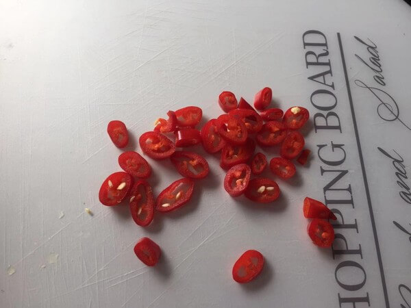 Red peppers are cut into small circles