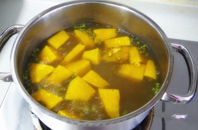 Add pumpkin pieces and continue to cook