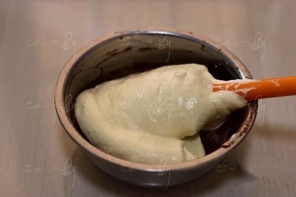Pour a small portion of the batter into the cocoa butter