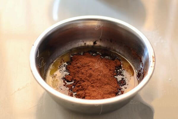 Pour the cocoa powder into the butter and milk mixture