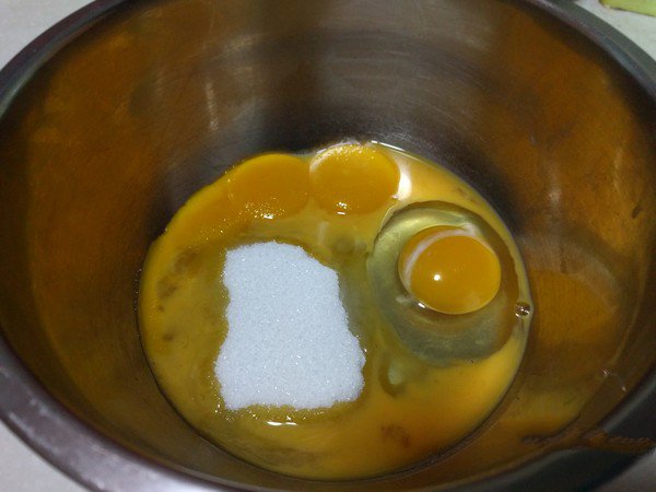 Pour the yolks and whole eggs into a small bowl