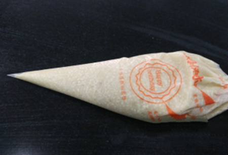Into a disposable squeeze bag, with scissors to squeeze the mouth cut a hole.