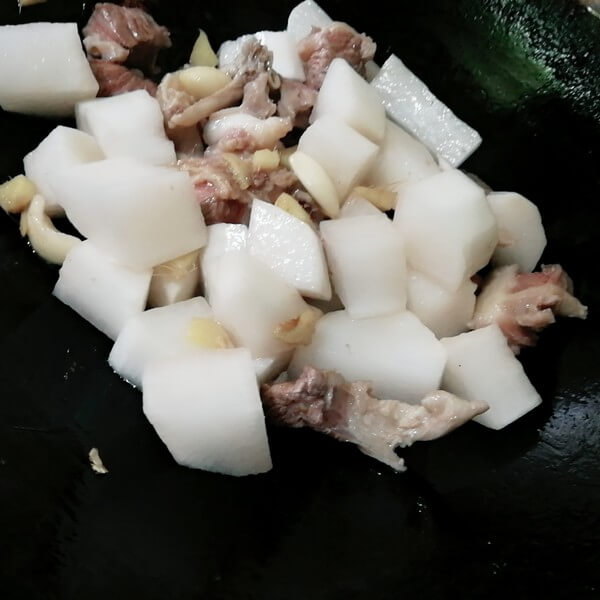 Then put the white radish down and stir fry for one minute,