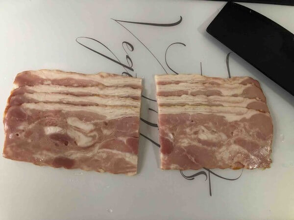 The bacon is cut in half from the middle.
