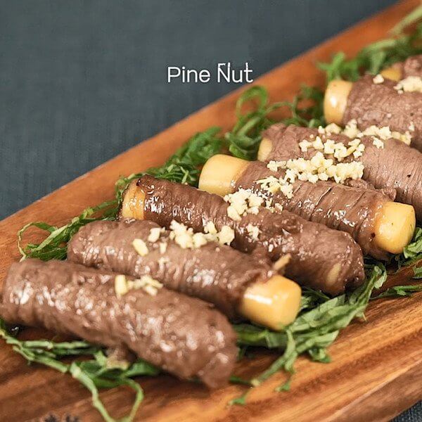 Sprinkle with crushed pine nuts to finish