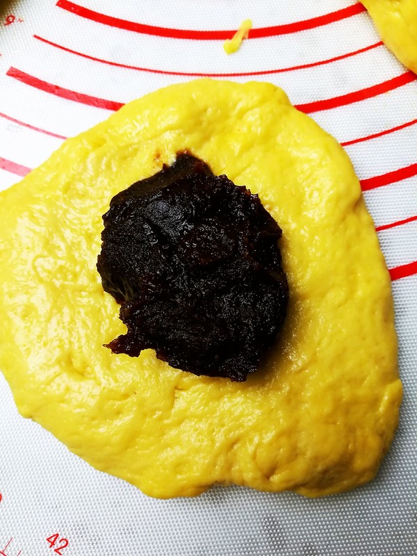 Roll out the dough and put in the filling just like you would a bun.