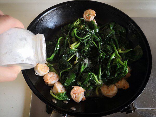 Stir fry twice and add salt to season;