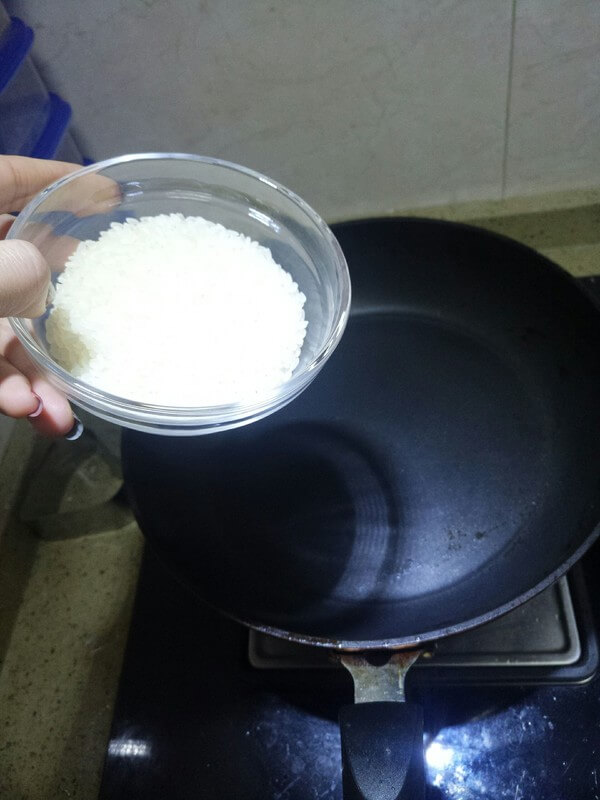 Pour rice into a non-stick pan