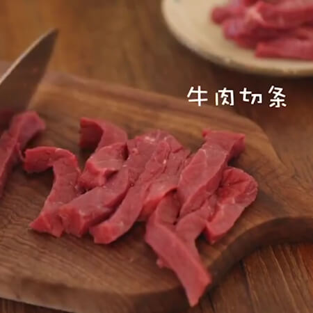 Beef cut into strips.
