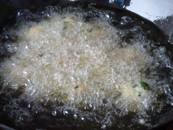 Deep fry in oil pan until golden surface, remove and set aside