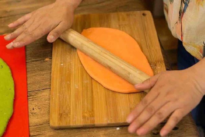 Use a rolling pin to roll the dough into a thin rectangle.