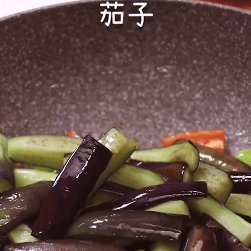 Pour in green and red peppers and eggplant
