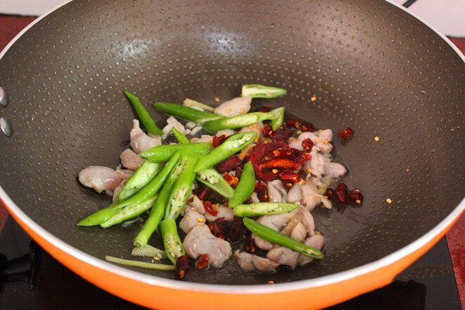 Add dry chili and green pepper and stir fry;