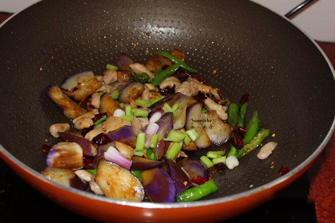 Add salt, soy sauce, stir fry to collect the juice, put the shallot and stir-fry.
