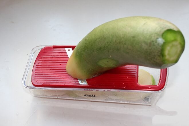 Wash a green radish