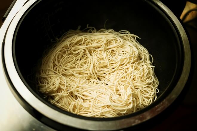 Lay the noodles, leaving some gaps in the middle