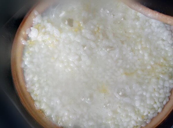 Wait for the water in the pan to dry slightly,