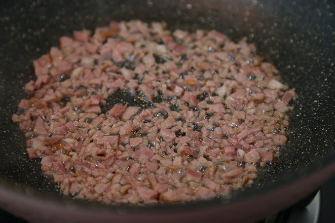 Pour some oil into the pan and stir-fry bacon into the pan