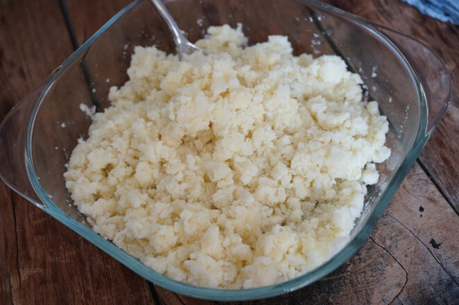 The potatoes are steamed and pressed into mashed potatoes with a spoon
