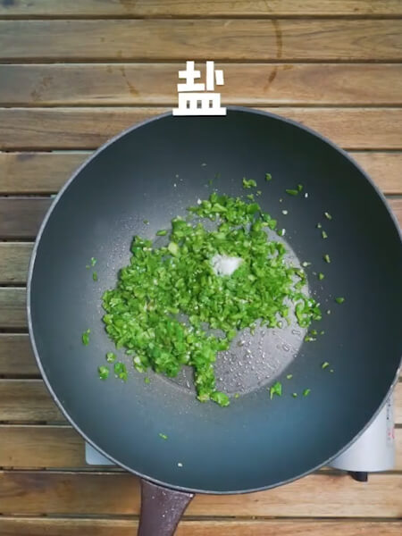 Pour in salt and stir fry evenly