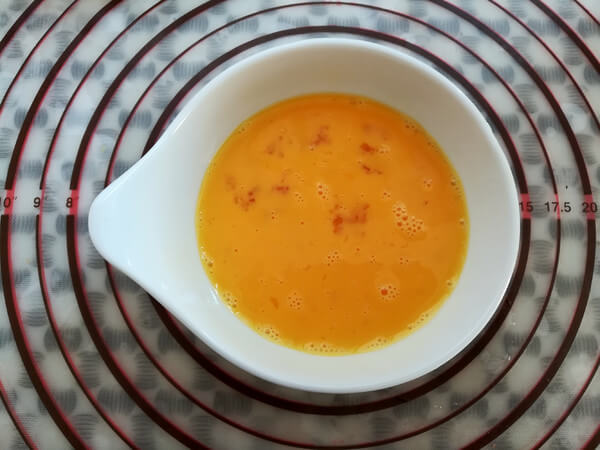 Beat eggs and mix well