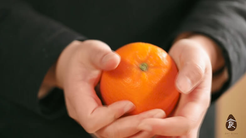 Pinch the orange