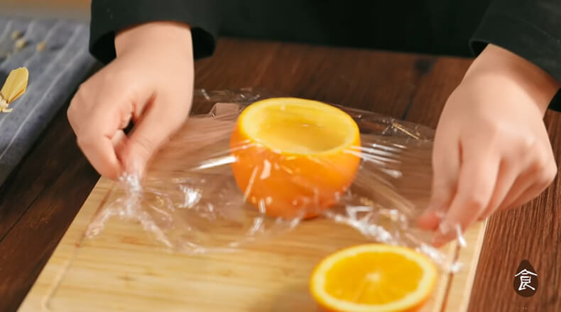 Wrap the oranges in plastic wrap