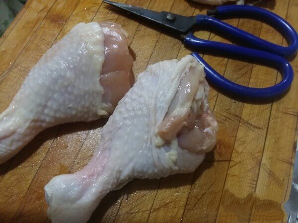 Remove bones from chicken legs.